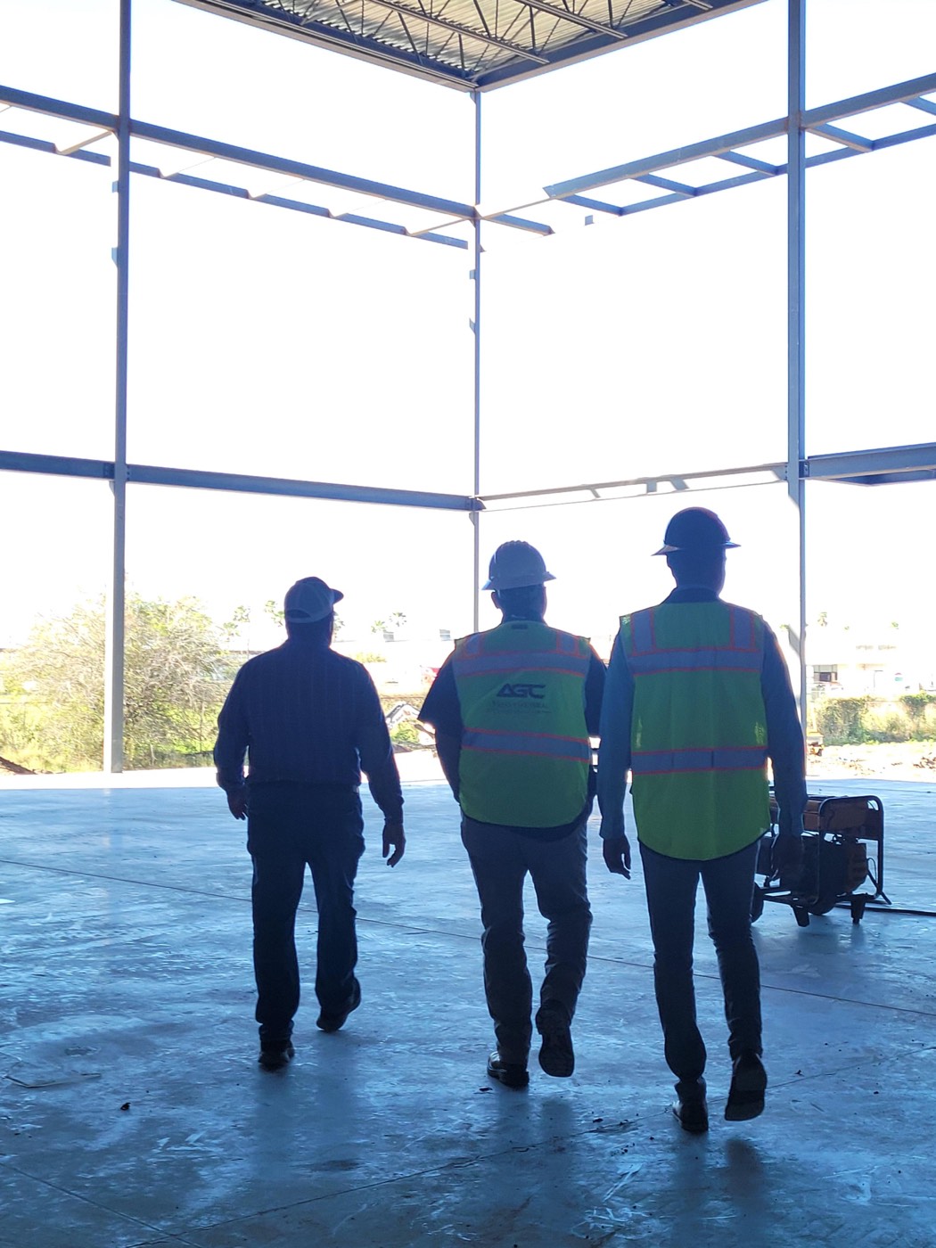 Three workers entering site