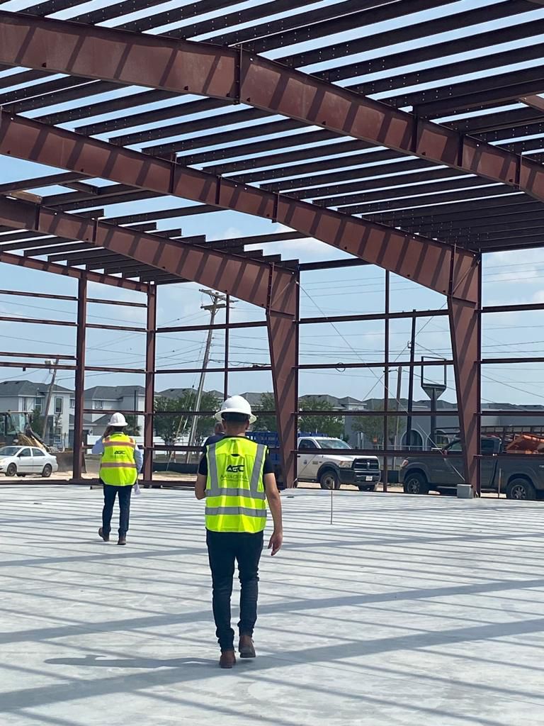Workers in steel frame walk