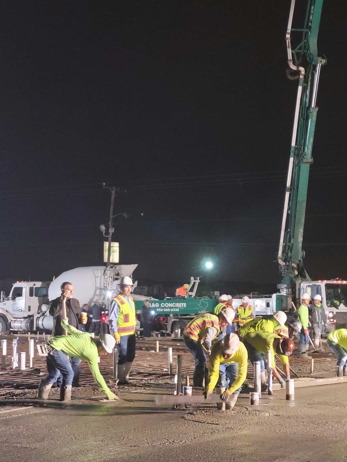 Night concrete pour, crew on site