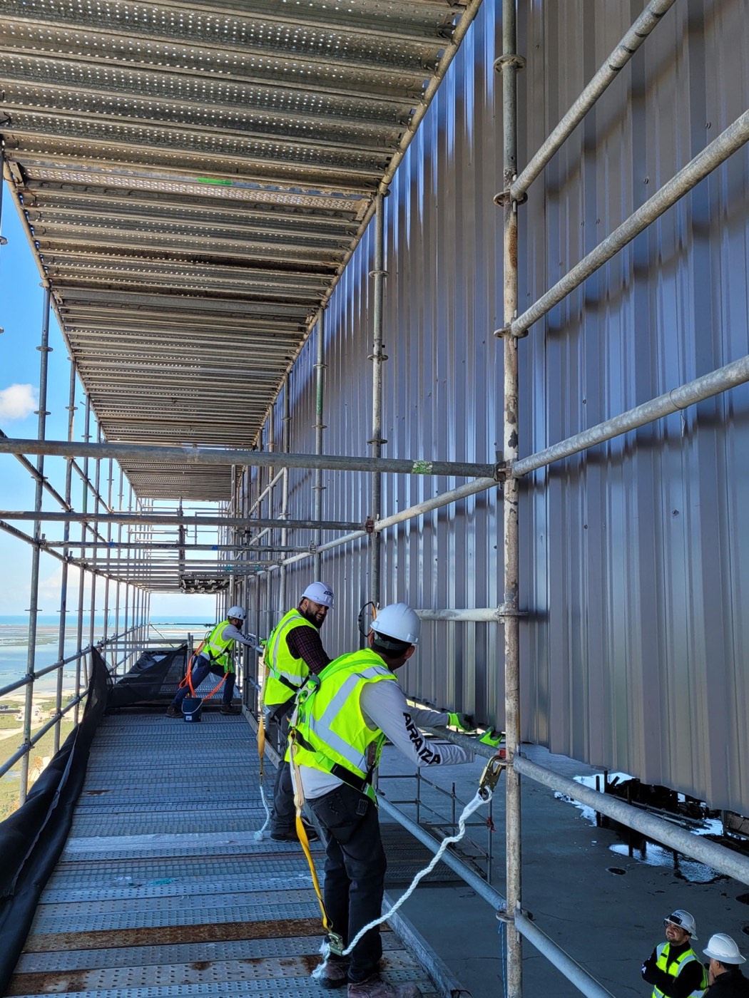 Crew installing cladding
